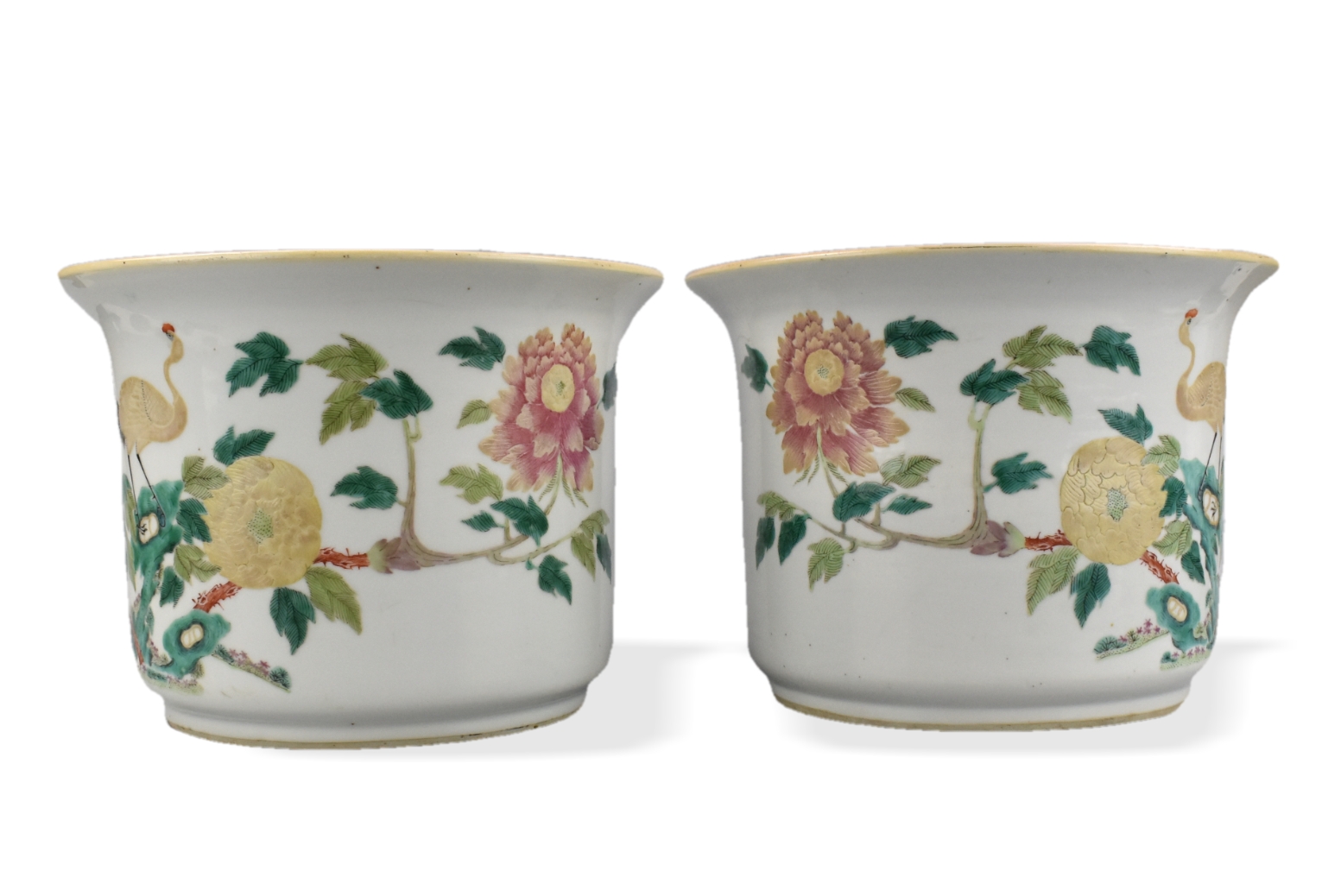 Appraisal: Pair of Chinese th C famille rose flowerpots featuring a