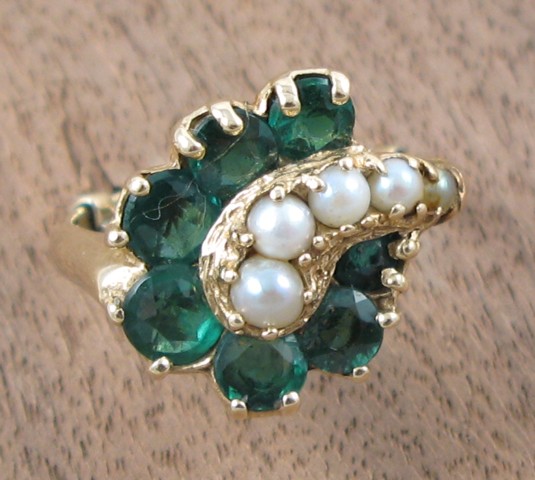 Appraisal: EMERALD SEED PEARL AND YELLOW GOLD RING the k gold