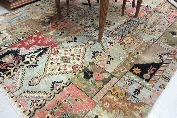 Appraisal: HAND KNOTTED ORIENTAL CARPET random color panel design without borders