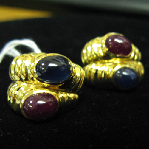 Appraisal: A PAIR OF RUBY SAPPHIRE AND FOURTEEN KARAT GOLD EARRINGS