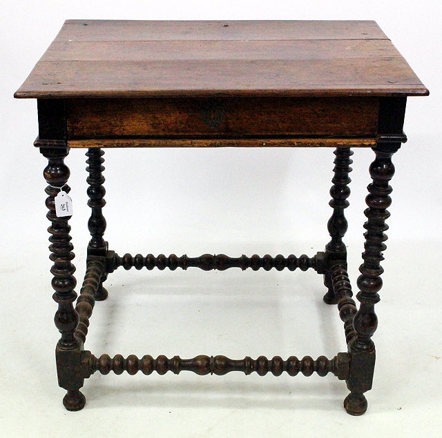 Appraisal: A VICTORIAN AND LATER WALNUT CANTERBURY with turned supports single