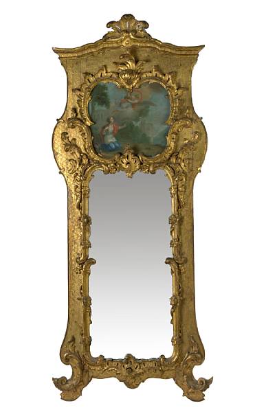 Appraisal: A Continental Rococo style giltwood trumeau mirror height ft in