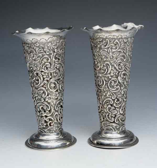 Appraisal: A PAIR OF LATE VICTORIAN VASES with pierced and pressed