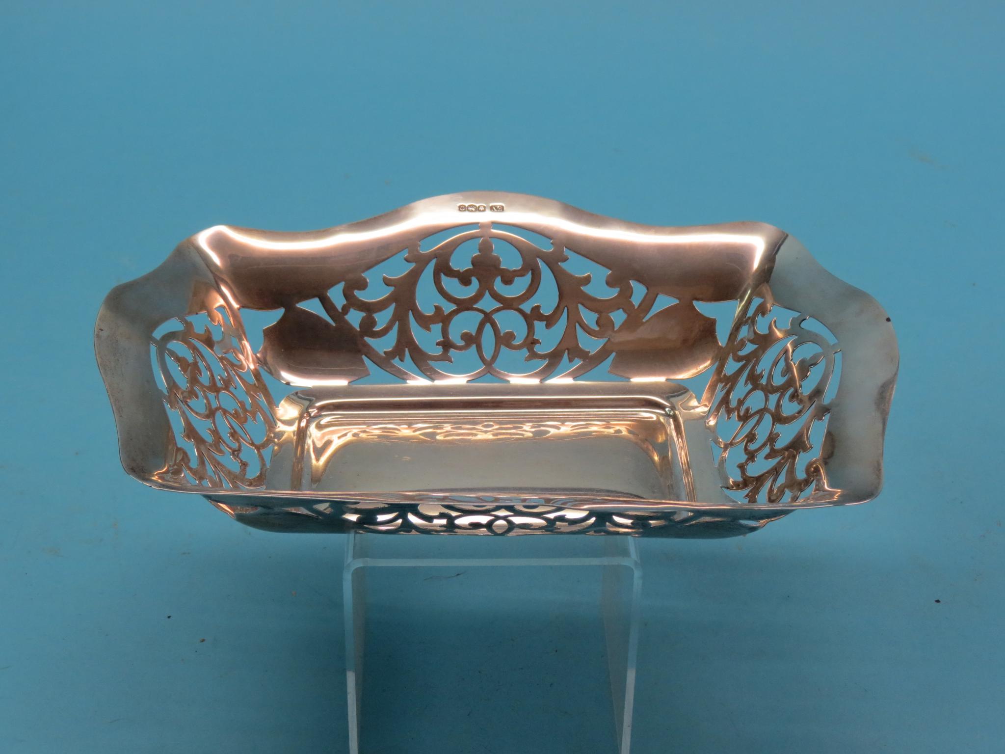 Appraisal: A silver fruit basket rectangular-shape with pierced scroll detail Viners