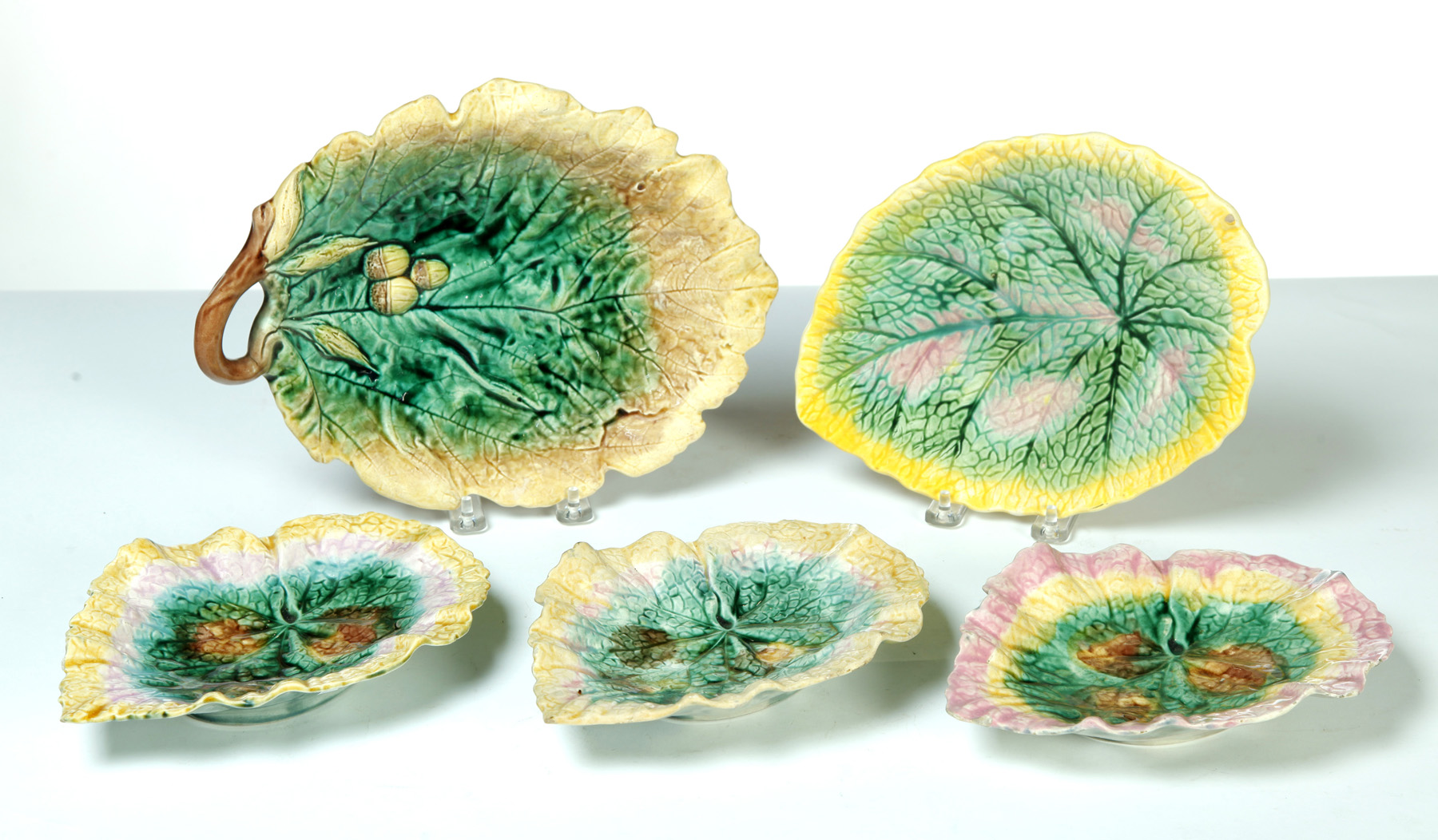 Appraisal: FIVE MAJOLICA LEAF PLATES England nd half- th century Patterns