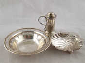 Appraisal: A silver kitchen pepper a silver shell butter dish London