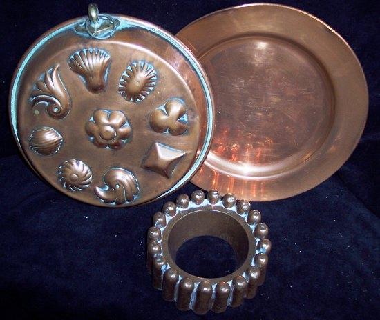 Appraisal: A large copper mould of circular form embossed various designs