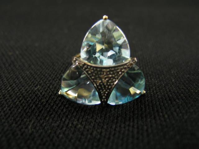 Appraisal: Blue Topaz Diamond Ring three triangular gems with fancy champagne