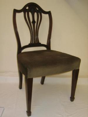 Appraisal: A PAIR OF GEORGE III MAHOGANY SIDE CHAIRS of Hepplewhite