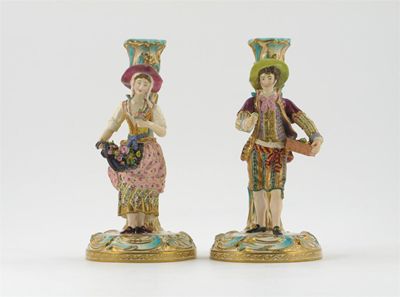 Appraisal: A pair of Minton figural candlesticks he holding a tray