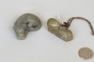 Appraisal: Two Small Chinese Carved Jade Dog Figures Two small Chinese