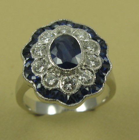 Appraisal: SAPPHIRE AND DIAMOND RING The k white gold setting centers