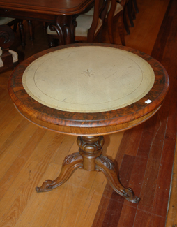 Appraisal: A VICTORIAN STYLE BURR WALNUT SIDE TABLE The circular leather