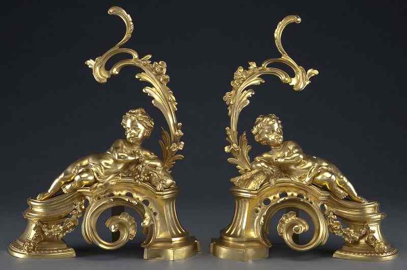 Appraisal: Pr Louis XV style gilt bronze chenets the puttireclining against