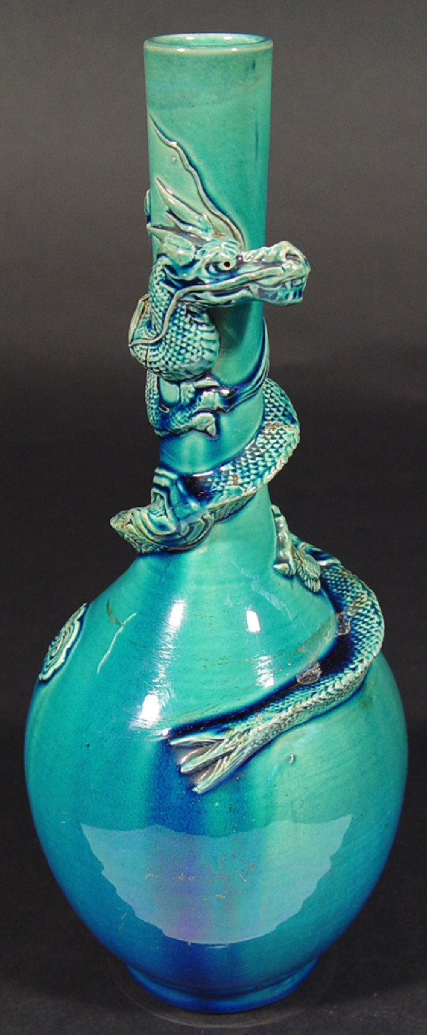 Appraisal: Oriental blue glazed bottle vase surmounted with a scaled dragon