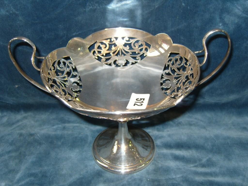 Appraisal: A silver fruit basket on pedestal foot with knopped stem