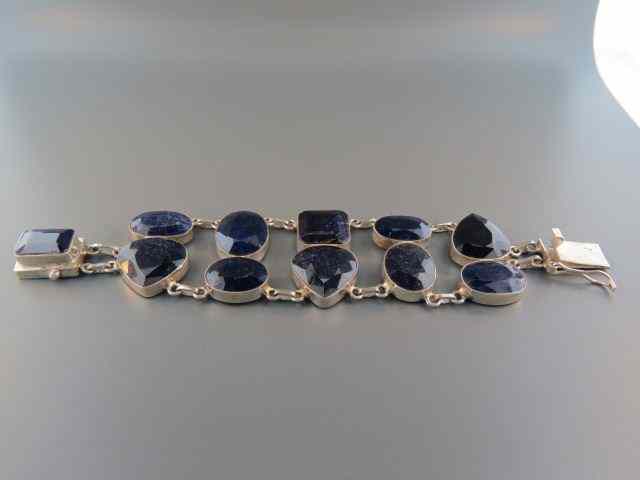 Appraisal: Sapphire Bracelet round pear shaped deep blue African gems totaling