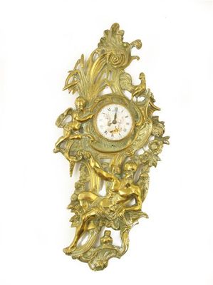 Appraisal: A cast gilt brass cartel clock with a watch movement