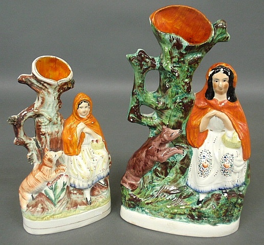 Appraisal: - Two Staffordshire Red Riding Hood spill vases c Largest