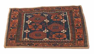 Appraisal: A Caucasian Carpet Fragment Small carpet with six abstracted medallions