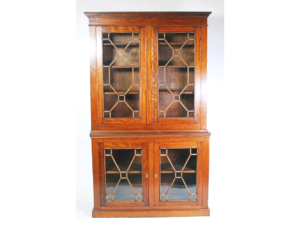 Appraisal: EARLY TWENTIETH CENTURY OAK BOOKCASE the moulded cornice above a