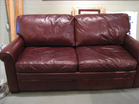 Appraisal: MODERN BURGUNDY LEATHER SLEEP SOFA h w d in