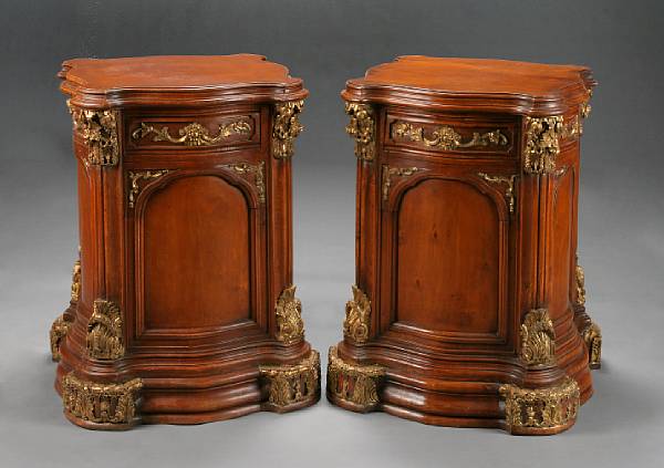 Appraisal: A pair of Neoclassical style parcel gilt fruitwood pedestals The