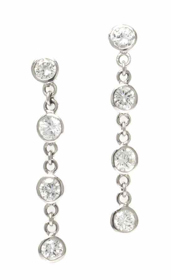 Appraisal: A Pair of Platinum and Diamond Dangle Earrings consisting of