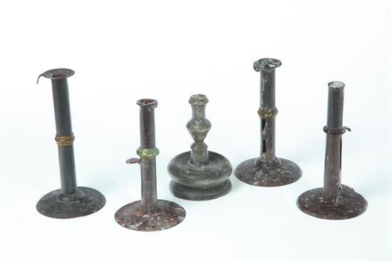 Appraisal: FIVE CANDLESTICKS American th century Four hogscraper candlesticks with lip