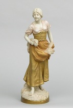 Appraisal: A Royal Dux Porcelain Figurine of a Maiden Carrying Bundle