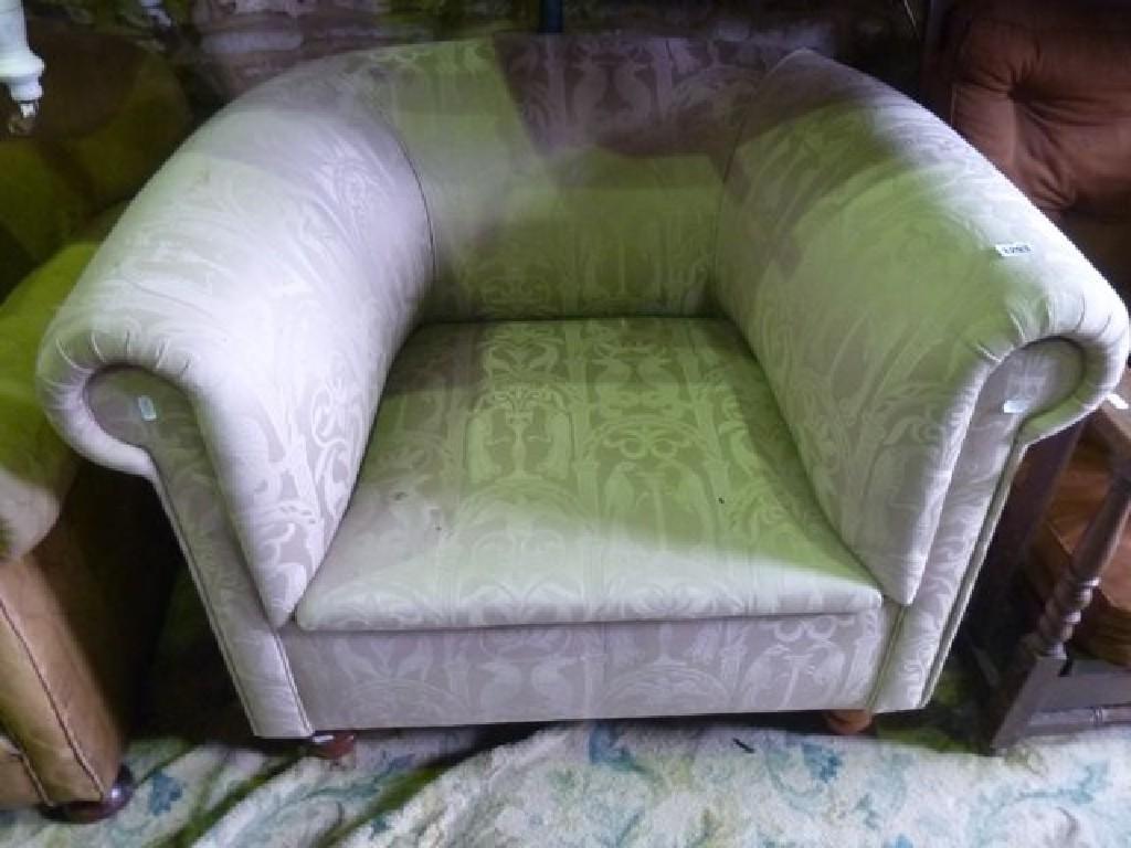 Appraisal: A contemporary Chesterfield chair with rolled arms upholstered finish and