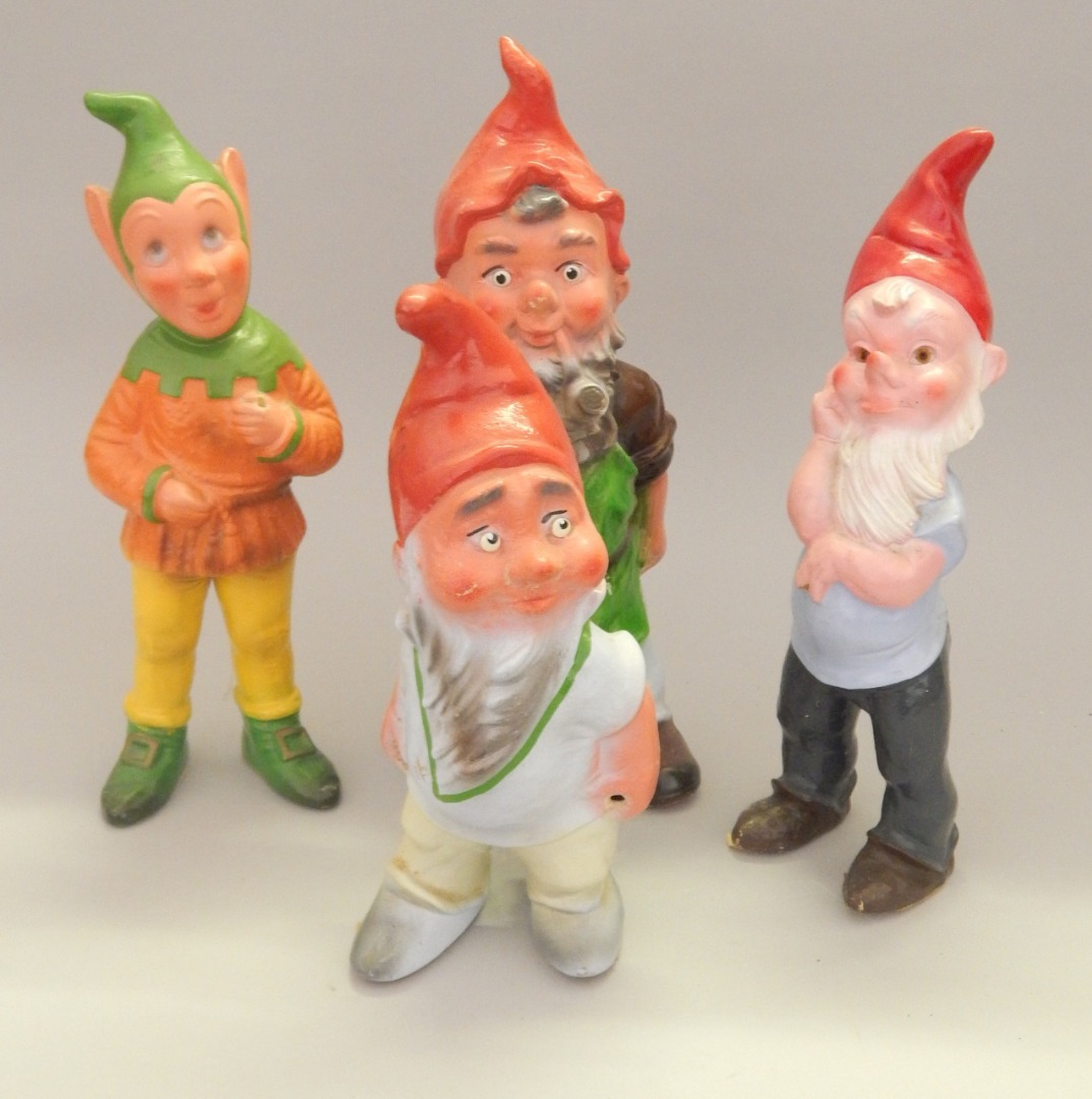 Appraisal: Four terracotta garden gnome etc to include figure with a