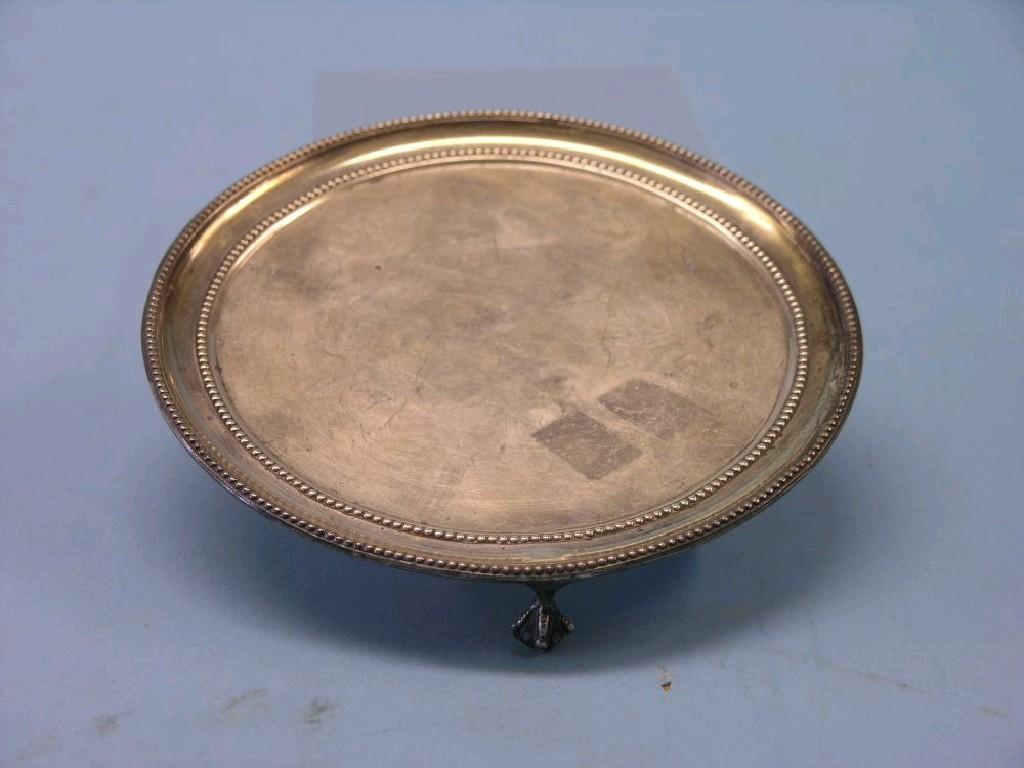 Appraisal: A Victorian silver card tray circular-shape with bead borders on