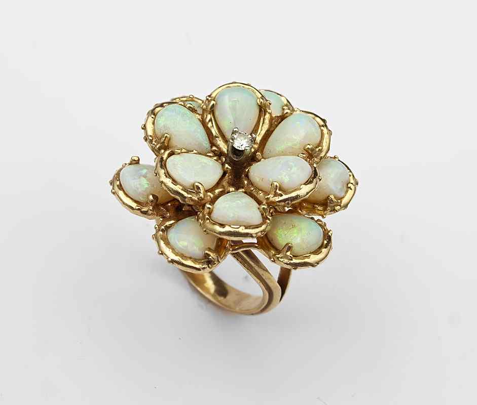 Appraisal: K OPAL DIAMOND FLOWER RING K yellow gold ring contains