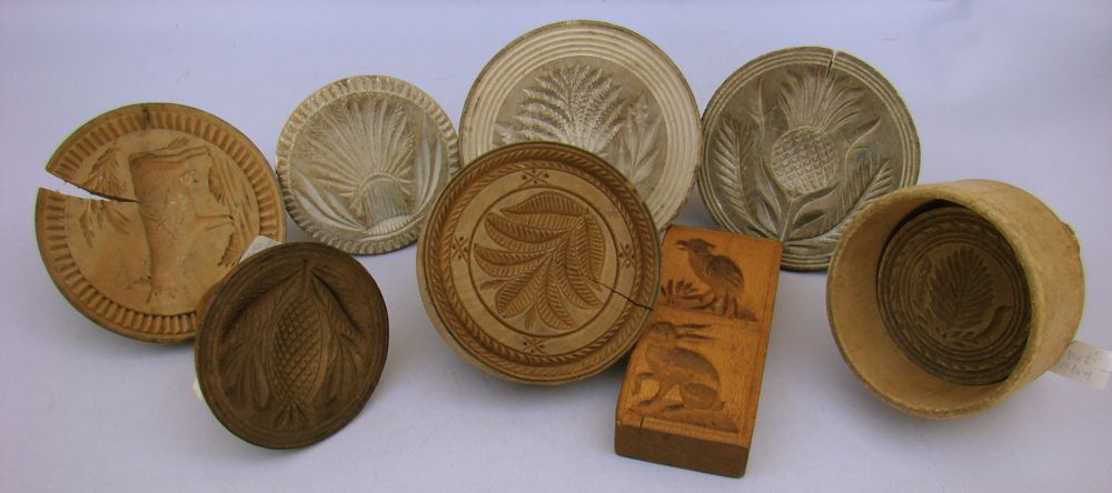 Appraisal: EIGHT WOODEN BUTTER MOLDS OR STAMPS th CenturyOne mold in