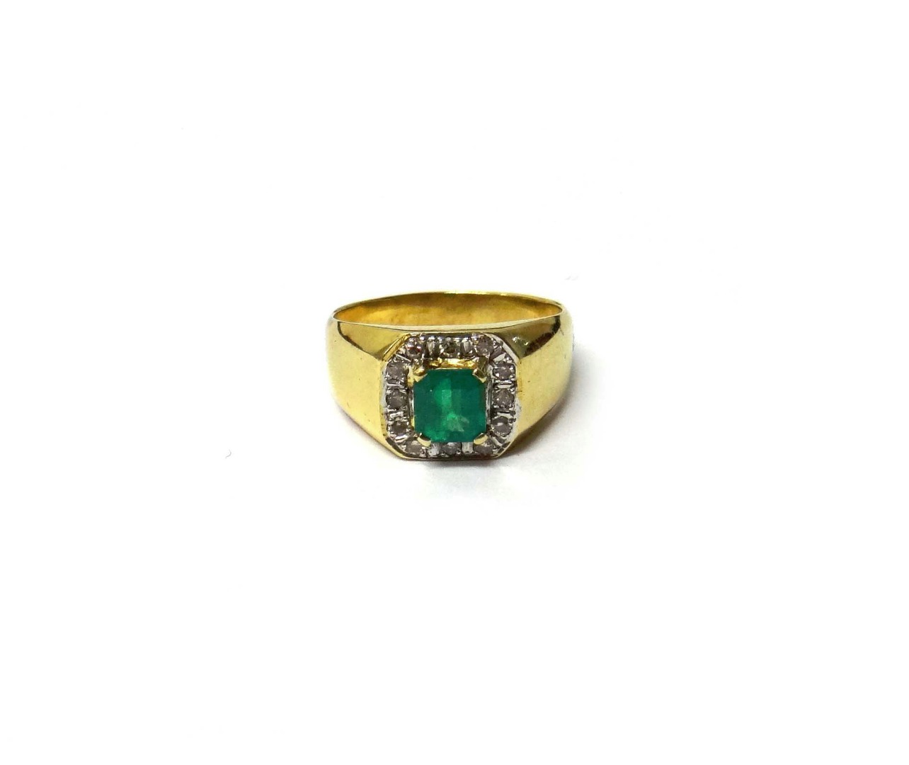 Appraisal: A gold emerald and diamond set ring claw set with