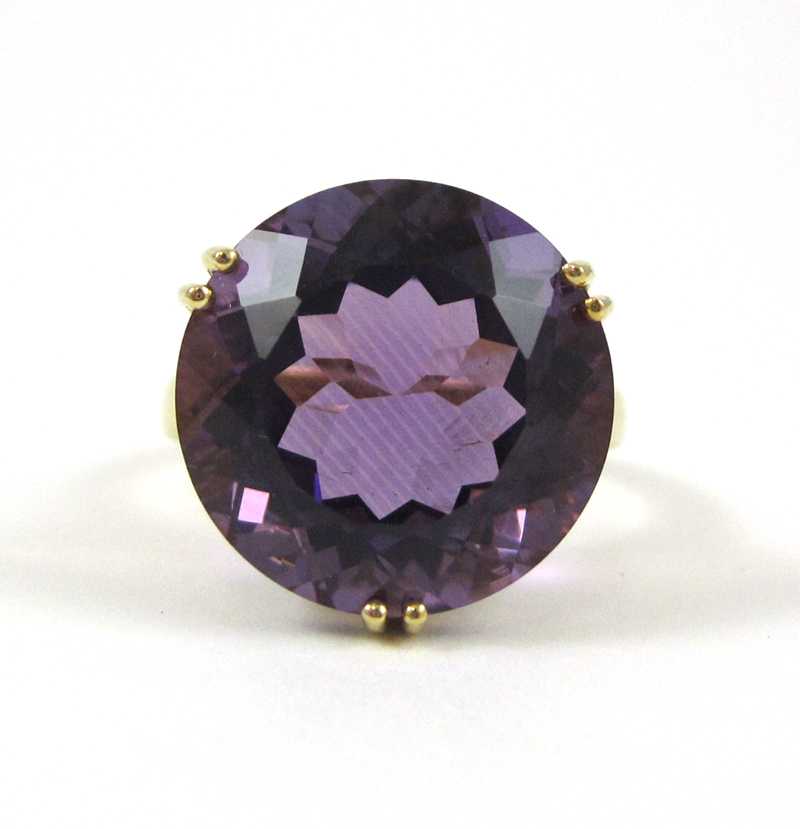 Appraisal: FOURTEEN KARAT GOLD AND PURPLE AMETHYST RING single round-cut purple