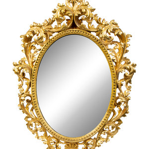 Appraisal: An Italian Rococo Style Carved Giltwood Oval Mirror and a