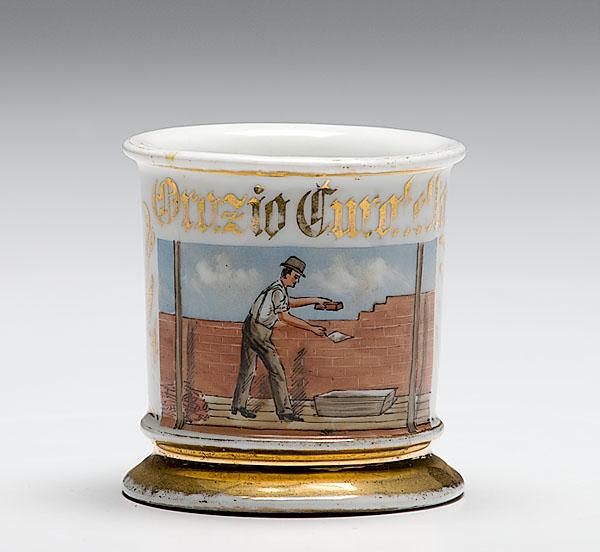 Appraisal: OCCUPATIONAL SHAVING MUG OF A BRICK LAYER porcelain with polychrome