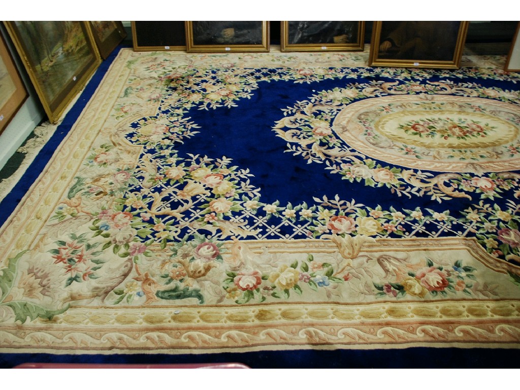 Appraisal: LARGE WASHED CHINESE CARPET OF AUBUSSON DESIGN with Royal blue