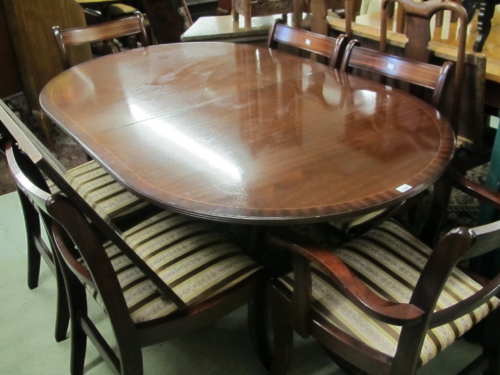 Appraisal: Reproduction dining table with six chairs and spare leaf