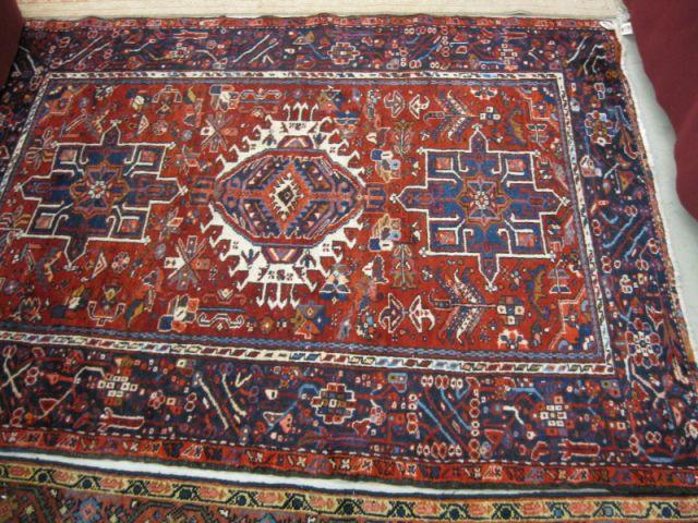 Appraisal: Heriz Persian Handmade Rug trio of central medallions rich reds