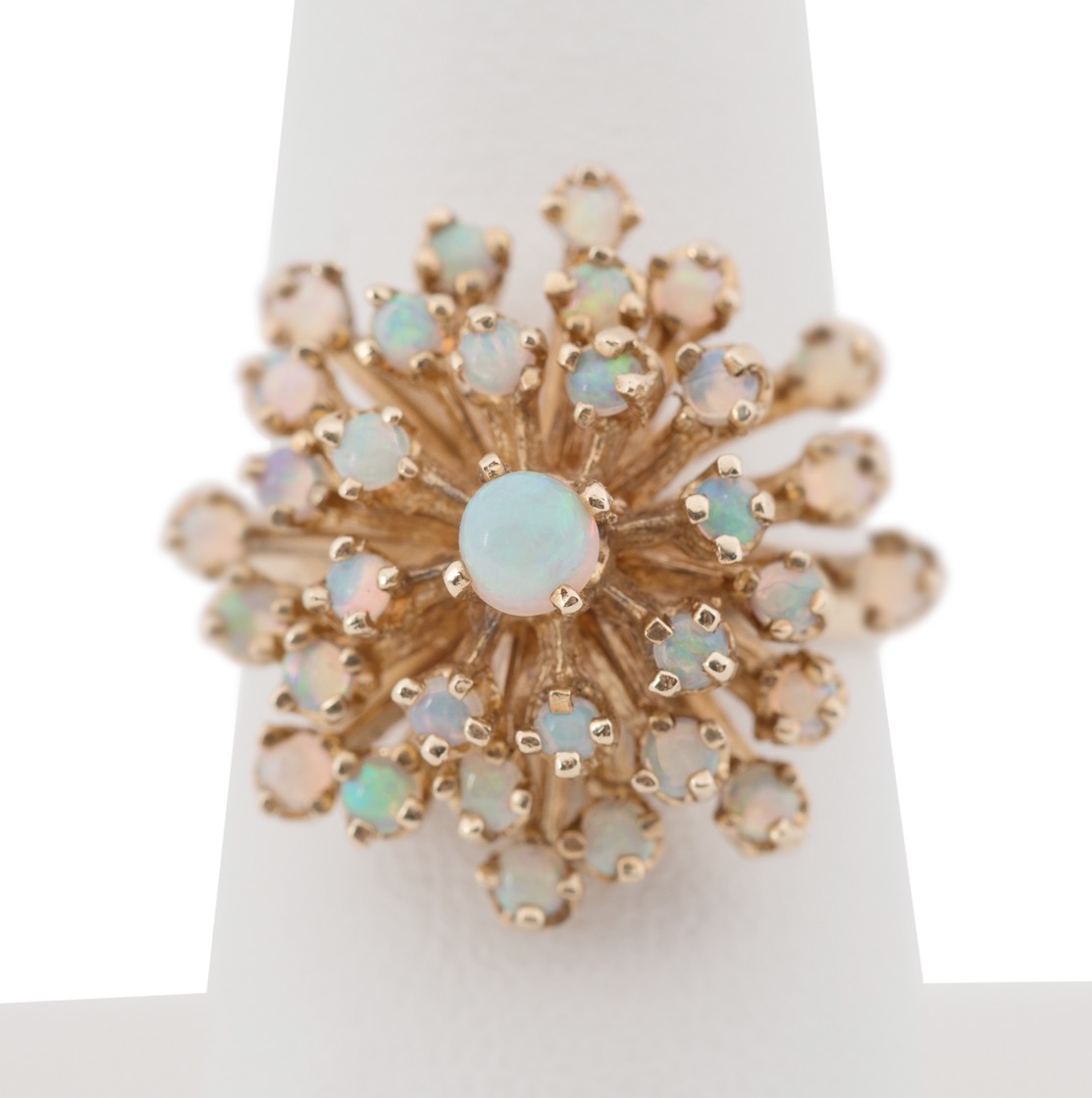 Appraisal: K YELLOW GOLD OPAL STARBURST RING k yellow gold and