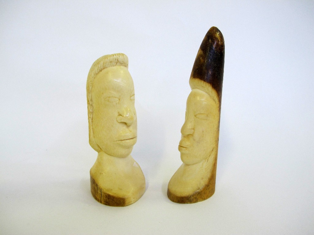 Appraisal: Pair of carved bone figure heads