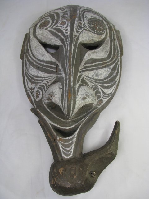 Appraisal: Wood carved and painted mask with bird at base with