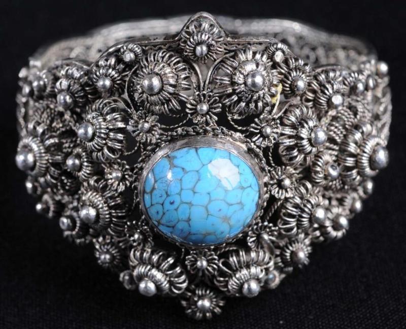 Appraisal: Hinged Bangle Bracelet Description Marked Turquoise colored stones Condition Excellent