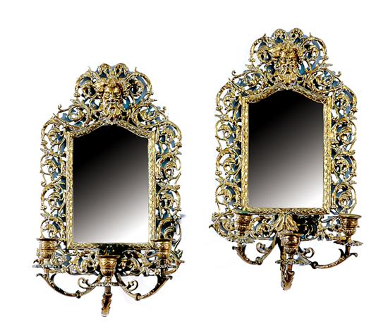 Appraisal: Pair American mirrored three-light sconces late th century pierced and