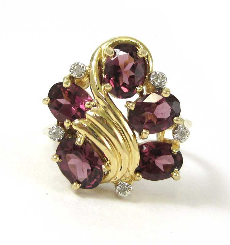 Appraisal: RHODOLITE DIAMOND AND FOURTEEN KARAT GOLD RING set with five