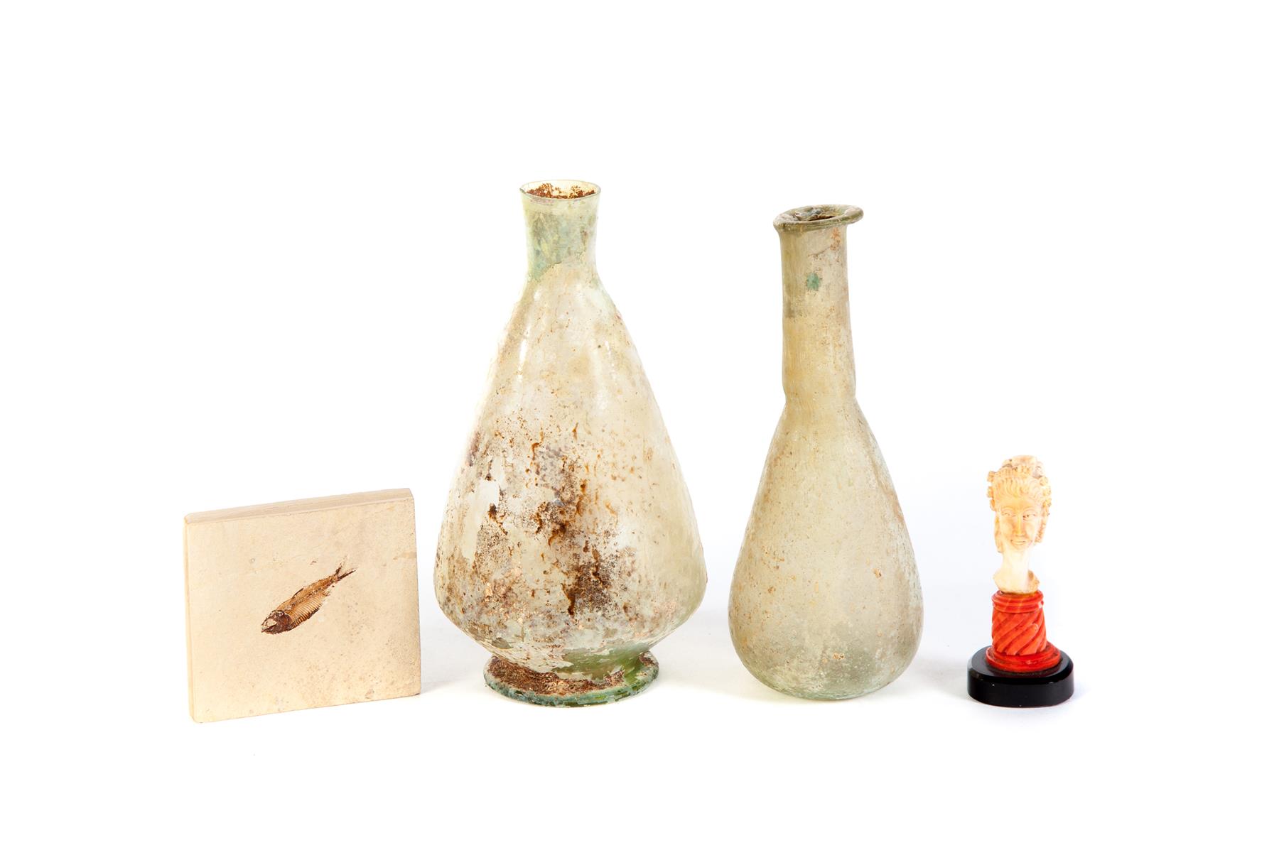 Appraisal: FOUR PIECES INCLUDING FOSSIL Two Roman blown glass dug bottles