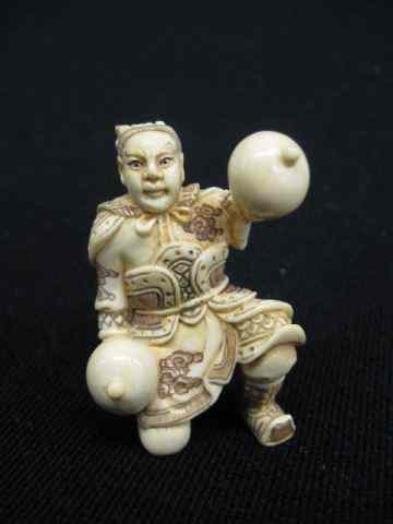 Appraisal: Carved Ivory Netsuke of Man Playing Musicalinstruments polychromed signed ''